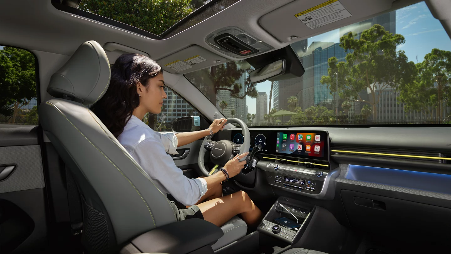 Interior A Woman Driving A 2025 Kona Electric